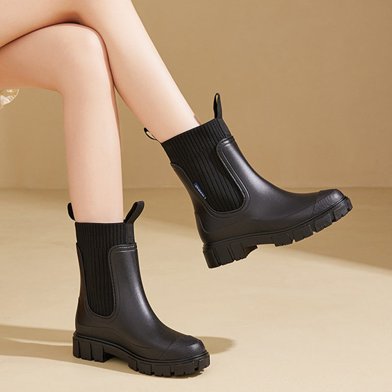 Waterproof, non-slip boots with a thick mid-calf sole